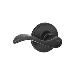 Dexter® by Schlage® Seville Privacy Door Lever in Aged Bronze at